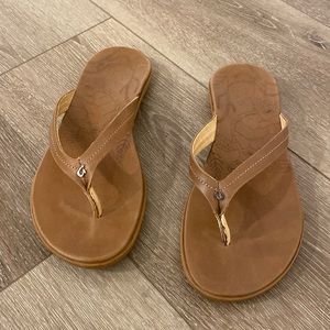 Olukai tan leather sandals with rubber sole. Think they are Honu model.